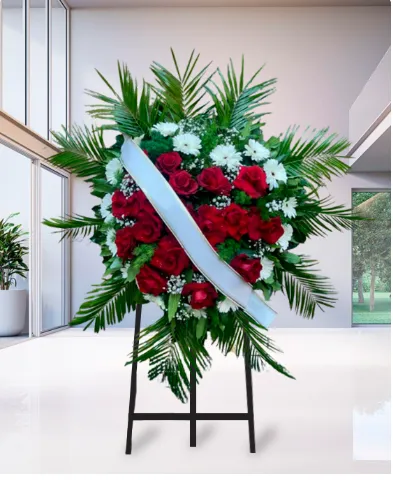 Corona funebre di rose rosse e crisantemi bianchi su cavalletto