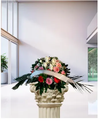 Cuscino funebre di gerbere e rose nei toni bianco, rosa e rosso