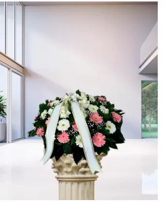 Cuscino funebre di fiori bianchi e gerbere rosa
