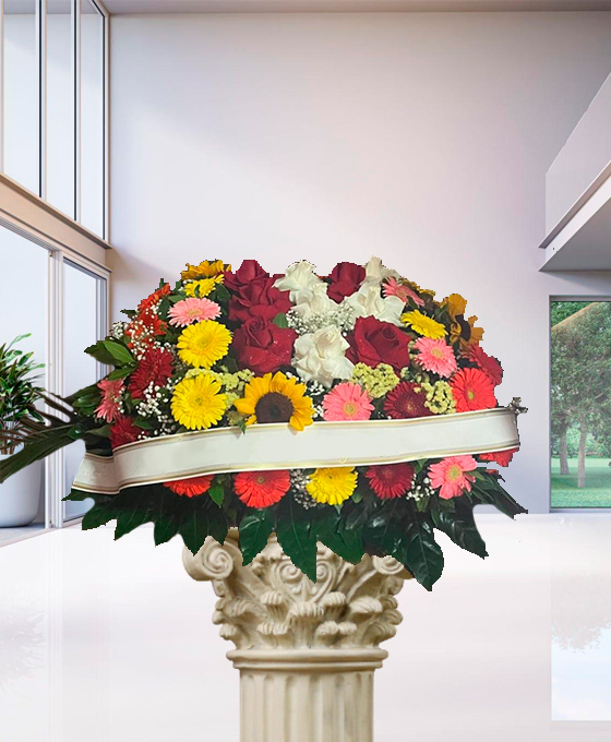 Cuscino funebre misto con girasoli e rose a Torino