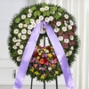 Corona funebre di anthurium verdi e gerbera bianca