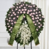 Corona funebre di colore rosa lilla e bianco
