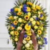Cuscino funebre di fiori gialli e blu