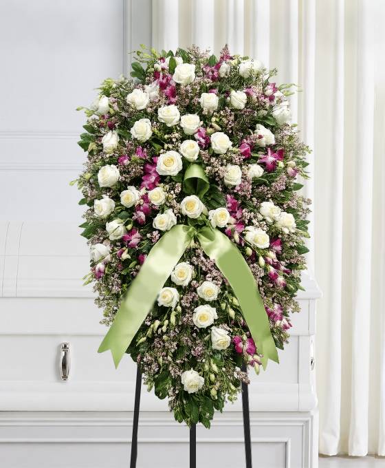 Cuscino funebre di rose bianche e dendrobium viola